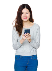 Fototapeta premium Young woman use of cellphone