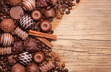 Collection of Belgian truffles. Chocolate candies on wooden back