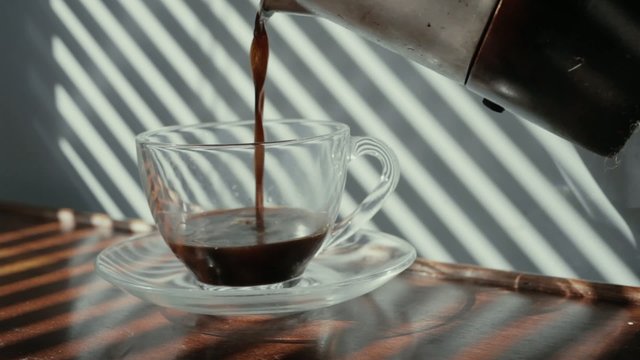  Coffee being poured into a cup 