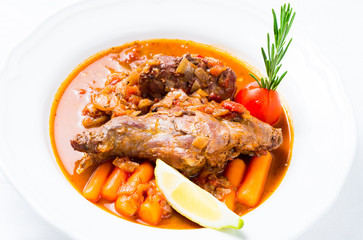 Rabbit stew with vegetables and herbs