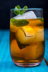 Glass of refreshing apple and mint juice with ice, drink backgro