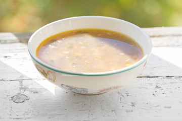 pickle soup in a white bowl