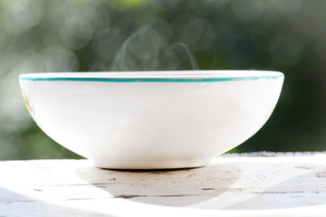 pickle soup in a white bowl