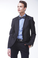 young handsome man in elegant suit with butterfly