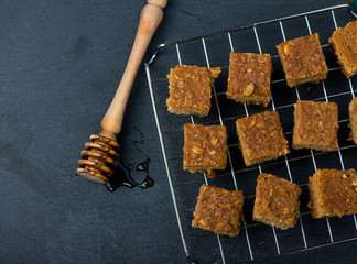 Homemade healthy flapjacks with honey on cooling rack