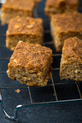 Homemade healthy flapjacks with honey on cooling rack