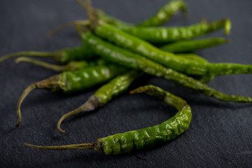 Burning hot vibrant green mexican chilli peppers