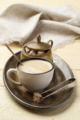 Morning coffee and sugar on a metal tray