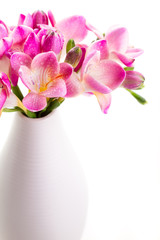 Bouquet of pink flower with drops in a vase