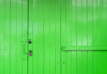 Fototapeta premium Wooden strong green door with lock