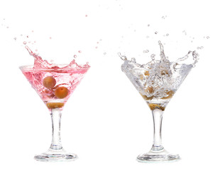 Splash from olive in a glass of cocktail, isolated on  white 