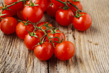 Fresh tomatoes on rustic wooden table