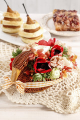 Bouquet of flowers in wicker goose.