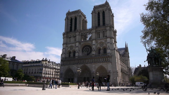 Tourist at cathedral Notre Dame in Paris, France