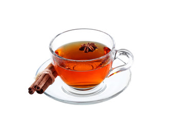 Delicious tea with spices in glass cup isolated on white 