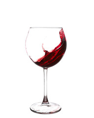 Red wine pouring on white background