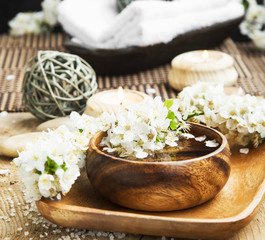 White Spa Flower Blossom in a Wooden Water Bowl.Beautiful Spa Tr