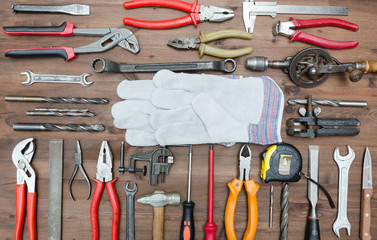 set of Different tools on wooden background