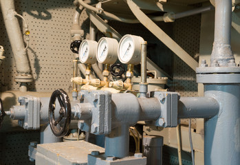 Old  metal tubes with a manometer 