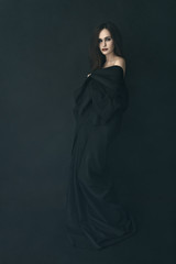 girl  black dress in a fog