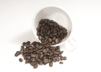 white cup with coffee beans isolated