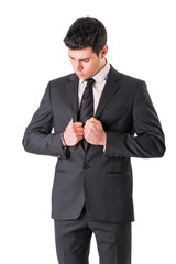 Young businessman confidently posing isolated on white