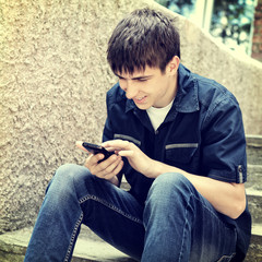 Teenager with Cellphone outdoor