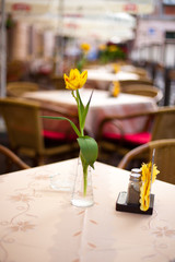 Naklejka na ściany i meble Flower on the table in cozy cafe