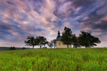 Fototapeta premium Colored sky over the small church, Brno, South Moravia, Czech