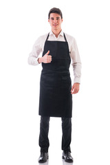 Full length shot of young chef or waiter posing isolated 