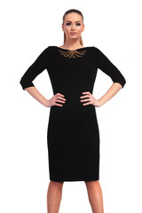 Fototapeta premium young elegant woman standing on studio background