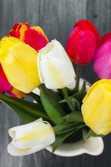 Fototapeta premium tulip bouquet on dark wooden background
