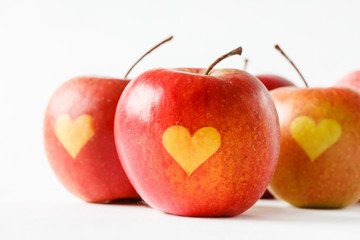 Red apples with a heart symbol