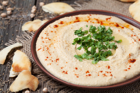 Hummus, healthy lebanese traditional creamy food with chick-peas