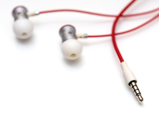 Modern portable audio earphones on a white background