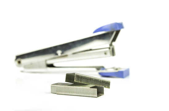 Staples and Stapler on white background, isolated
