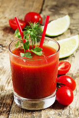 Red cocktail with tomato juice, lime and salt, selective focus