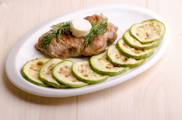 Pork steak, grilled, with melting butter and vegetables