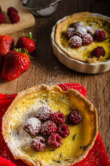 Lemon tart with rosemary and berries