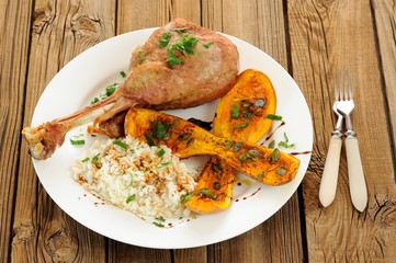 Roasted turkey leg with butternut squash, pumpkin seeds and rice