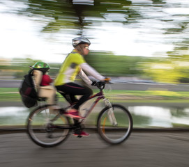 Cyclist in traffic on the city roadway