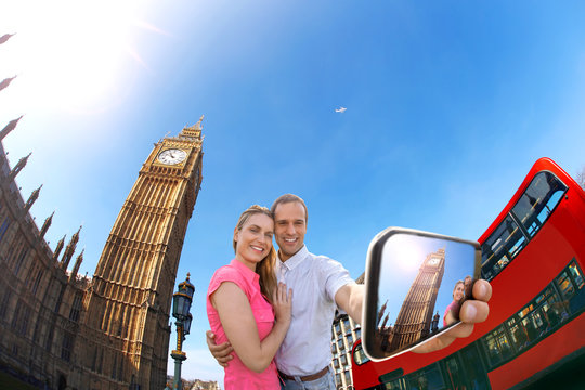couple taking selfie against Big Ben in London, England