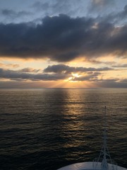 Sunset over the ocean from bow of oceanliner.