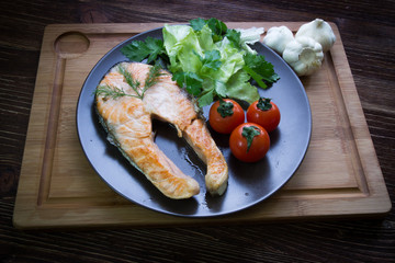 grilled salmon on the wooden table