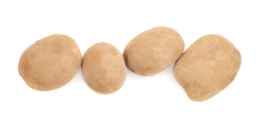 Fototapeta na wymiar Four brown potatoes lined up
