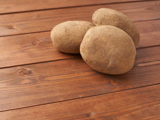 Fototapeta na wymiar Pile of brown potatoes composition
