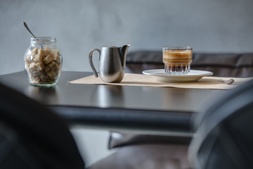 Coffee espresso on black glossy table.