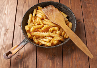 Cooking fried french potatoes composition