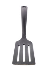 Used black plastic spatula isolated