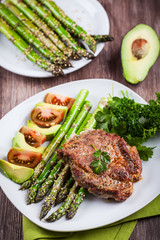 Glazed green asparagus with grilled pork chop